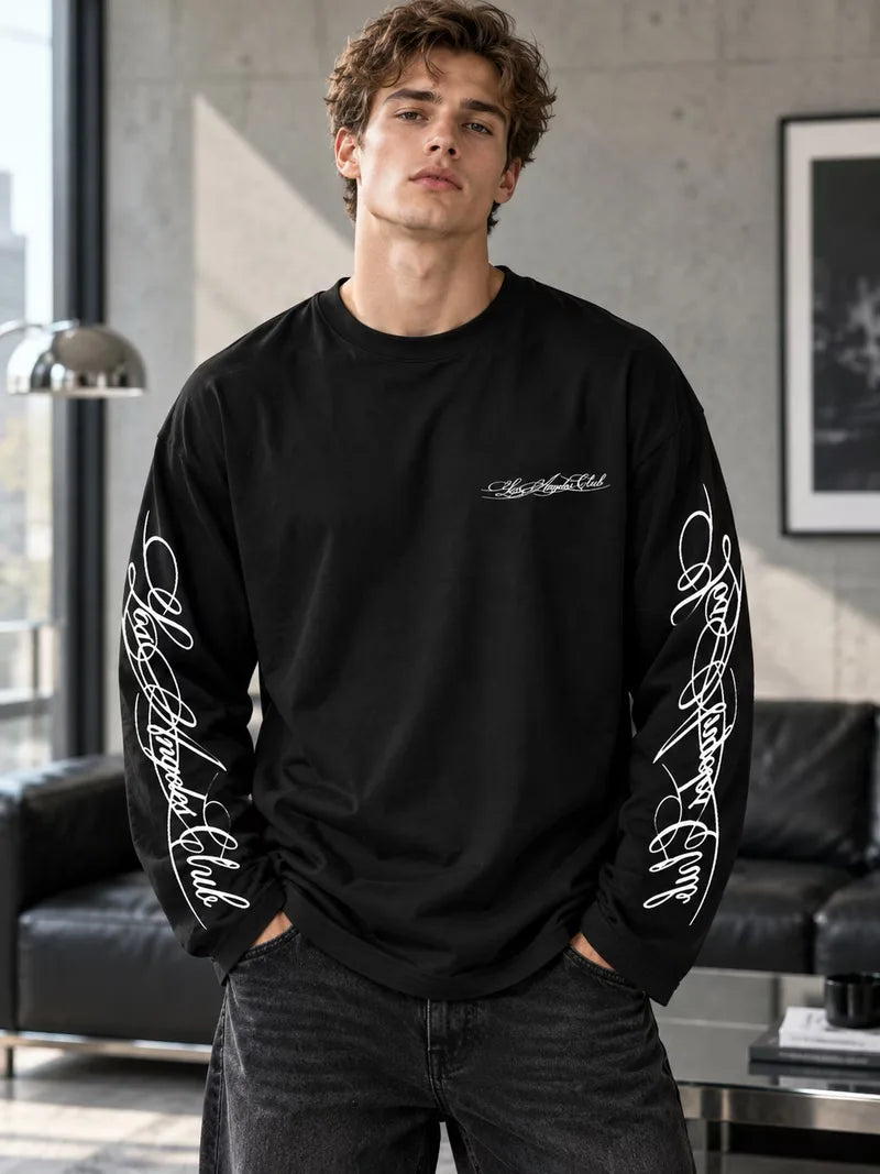 Long sleeve crew neck top with contrasting graphic prints on the sleeves