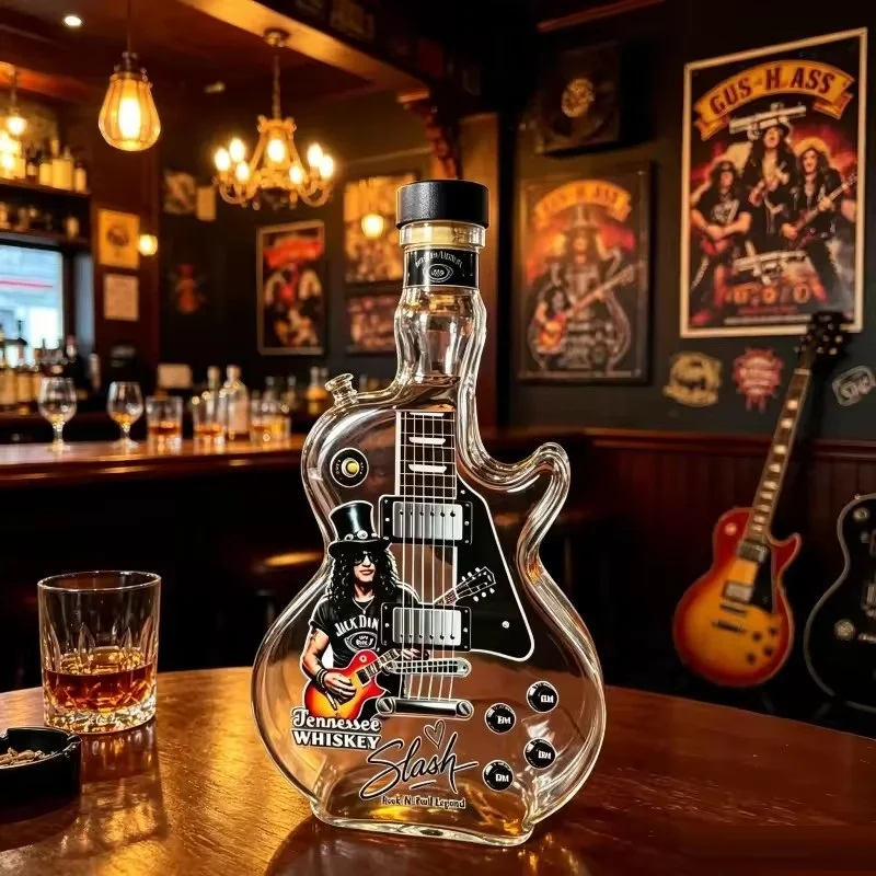 Guitar-shaped amber-toned decorative decanter with rock design and black display base