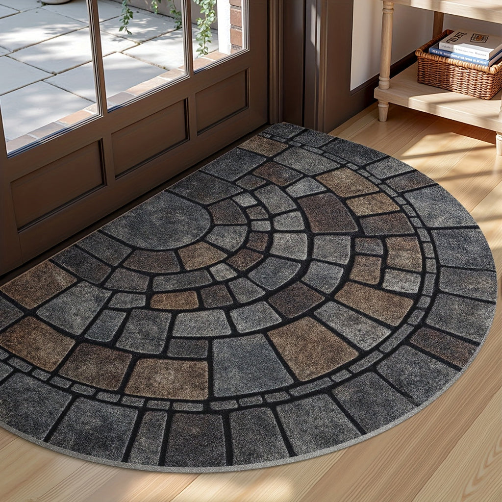 Half-circle gray geometric mosaic door mat at an entryway