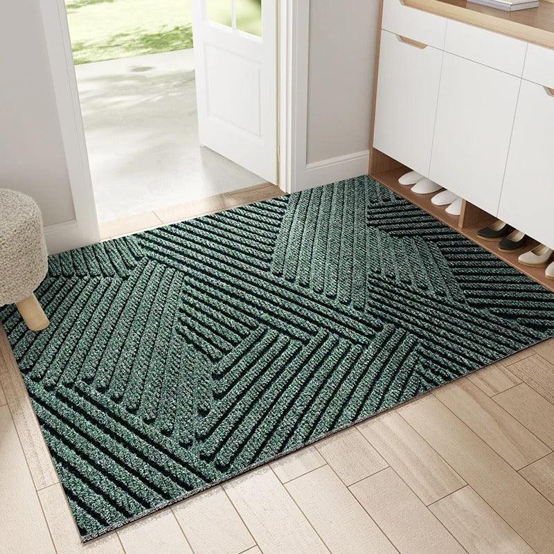 Rectangular ribbed geometric door mat in an indoor entryway
