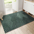 Rectangular ribbed geometric door mat in an indoor entryway