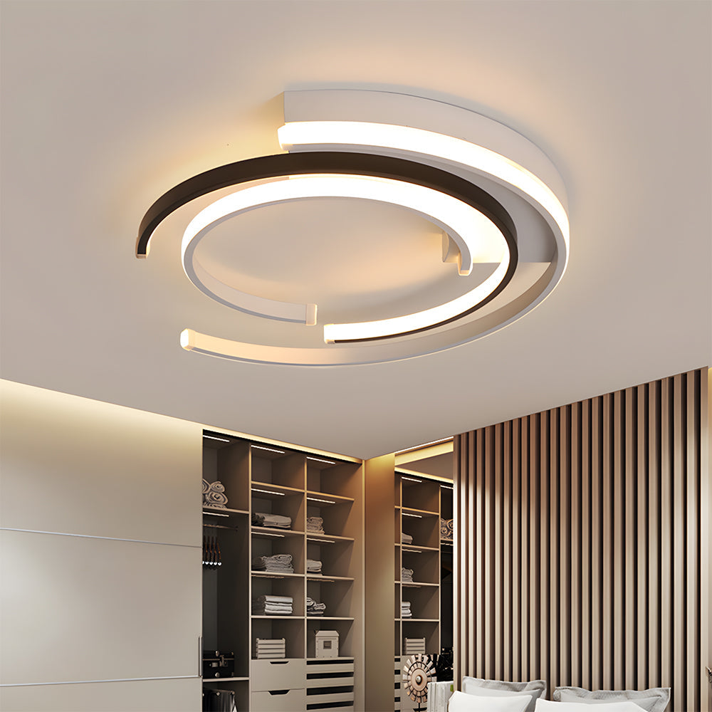 Black circular LED flush mount ceiling light with layered rings