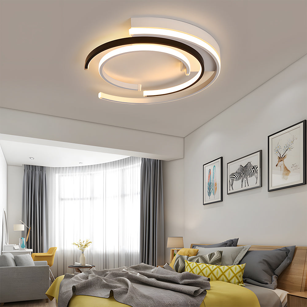Black circular LED flush mount ceiling light with layered rings