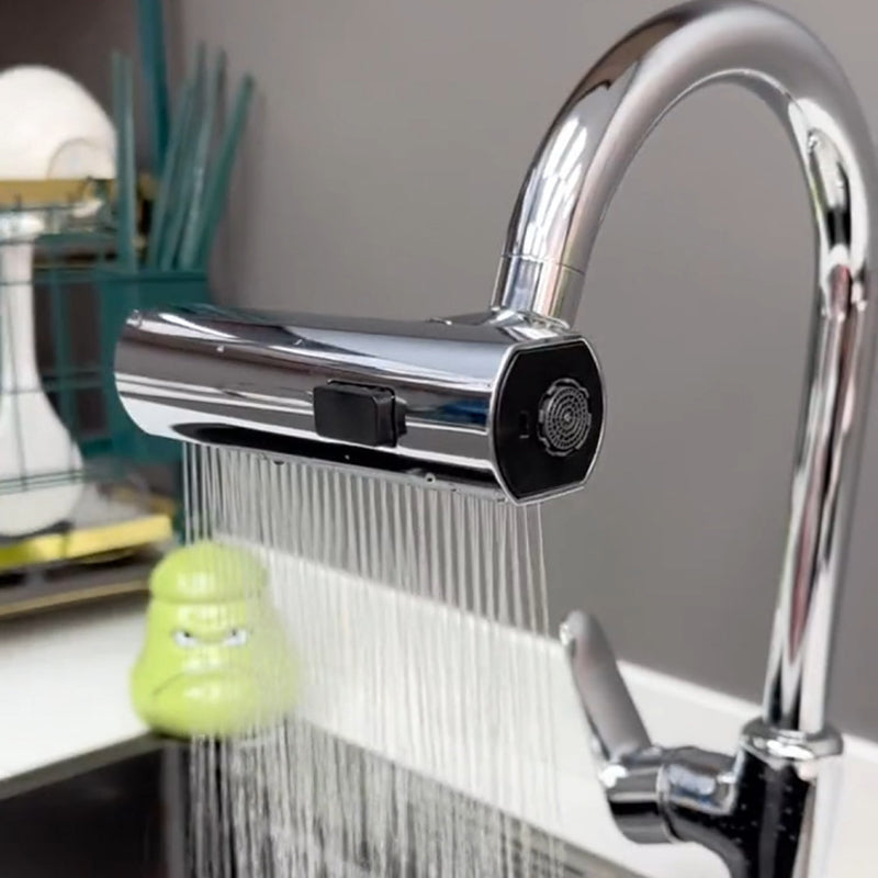 Chrome kitchen faucet attachment with flexible spray head over a sink
