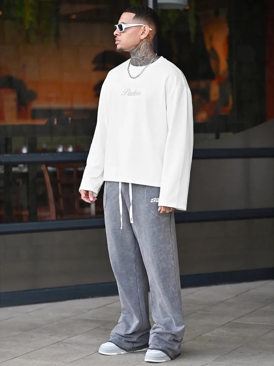 Oversized long sleeve shirt with graphic slogan design