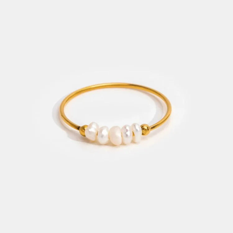 Gold-tone ring with a row of white pearl details