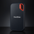 Black portable external SSD hard drive with red carry handle and USB cable