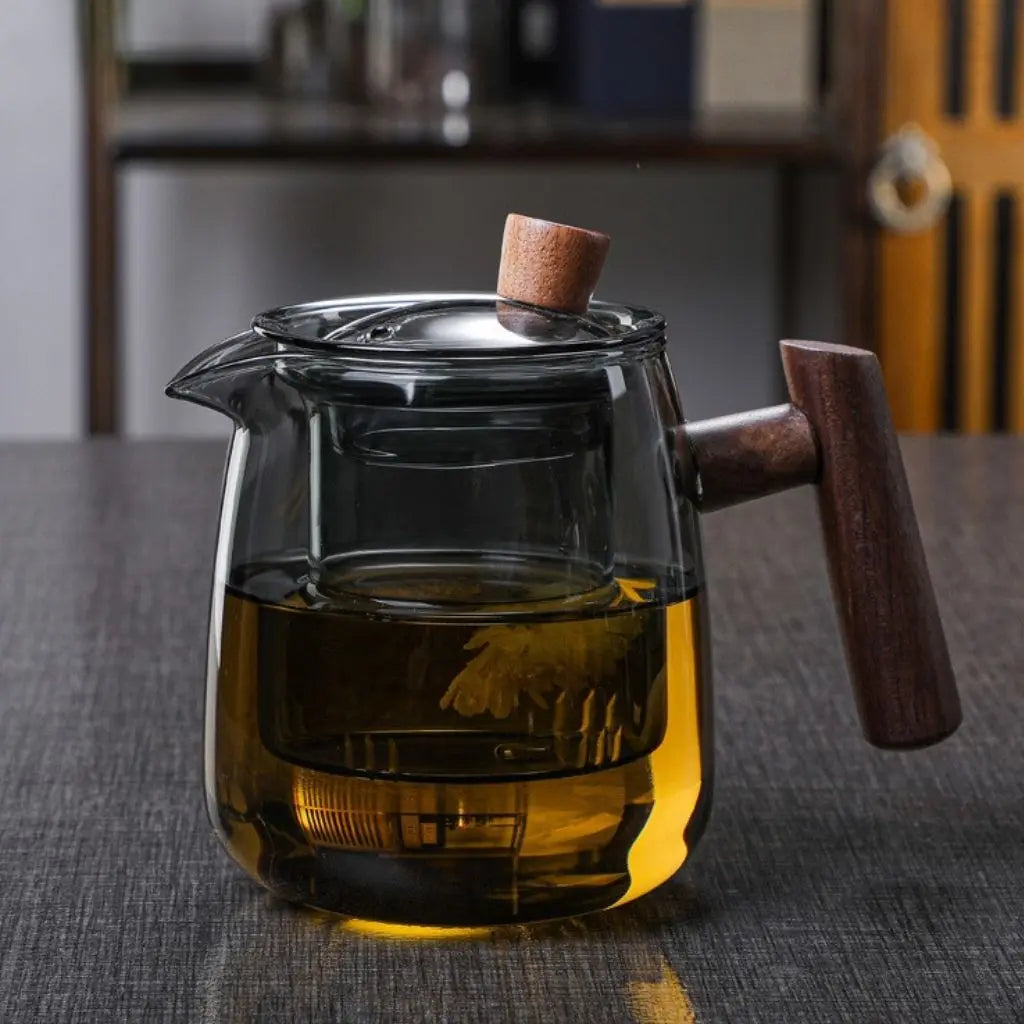 Glass teapot with central infuser, fitted lid and wooden handle