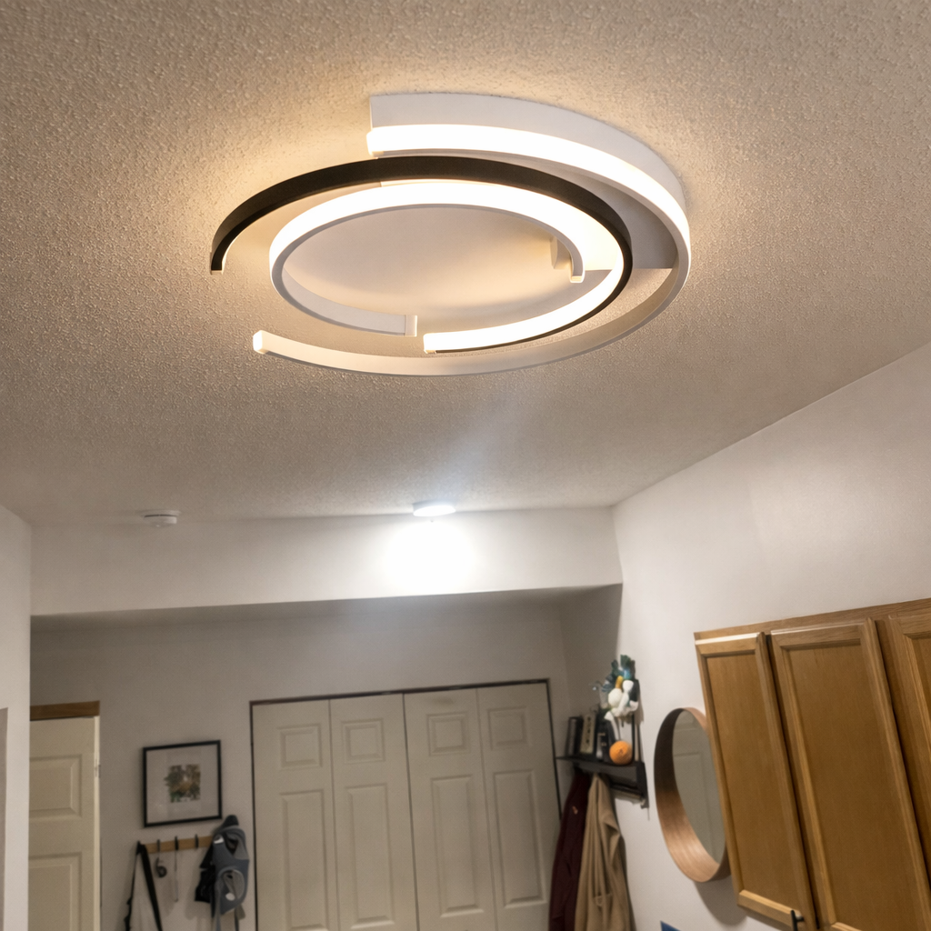 Black circular LED flush mount ceiling light with layered rings