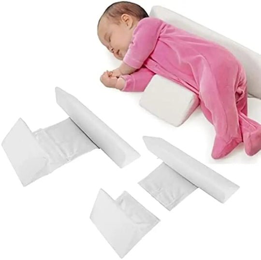 Infant sleep positioning pillow with central padded area and raised side supports