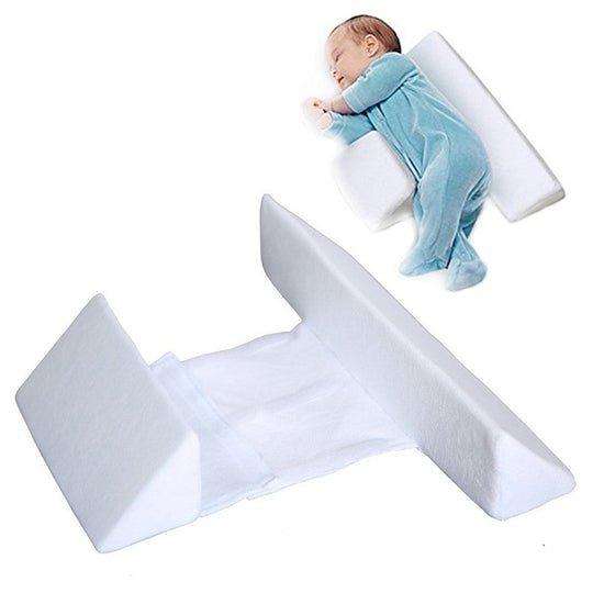 Infant sleep positioning pillow with central padded area and raised side supports
