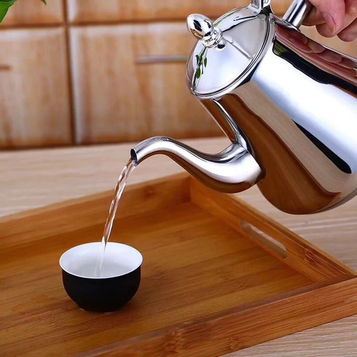 Induction stovetop kettle with curved spout and whistling lid