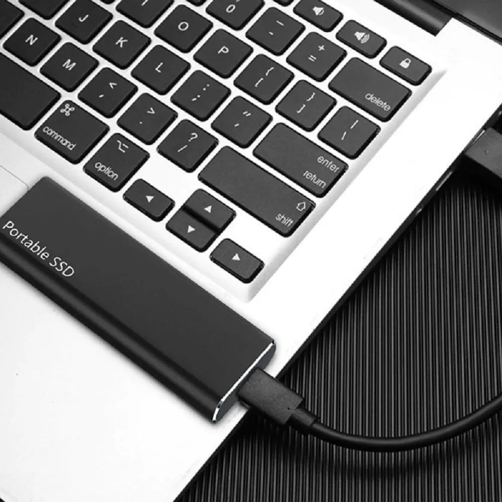 Portable external SSD with USB-C port, cable and connector adapters