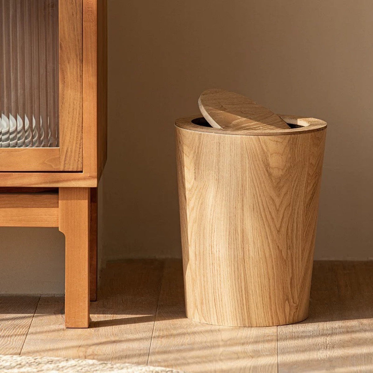 Brown wood-effect waste bin with oval rotating lid