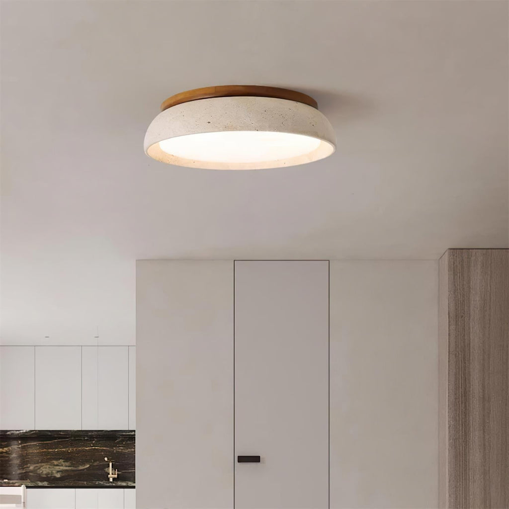 Round flush mount ceiling light with travertine finish and wood-effect trim