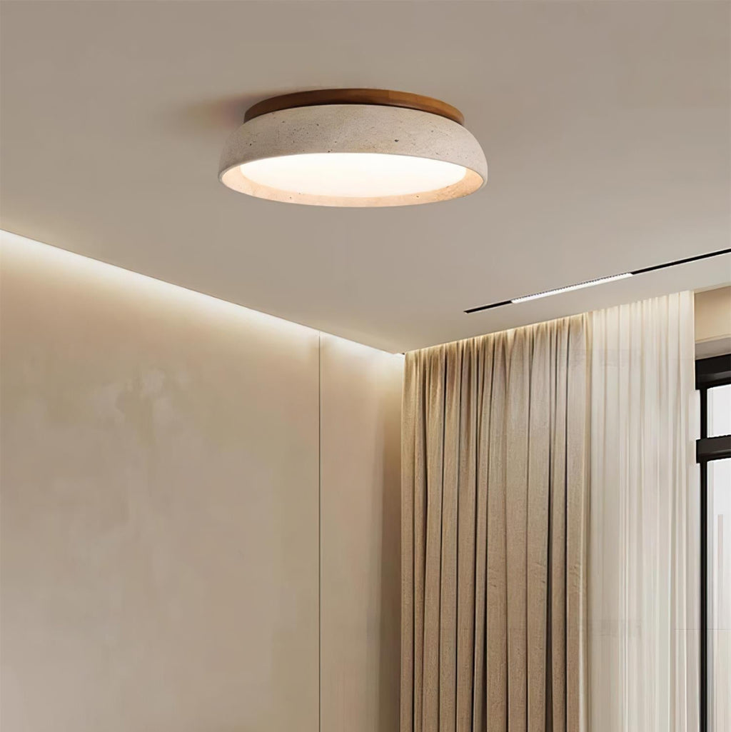 Round flush mount ceiling light with travertine finish and wood-effect trim
