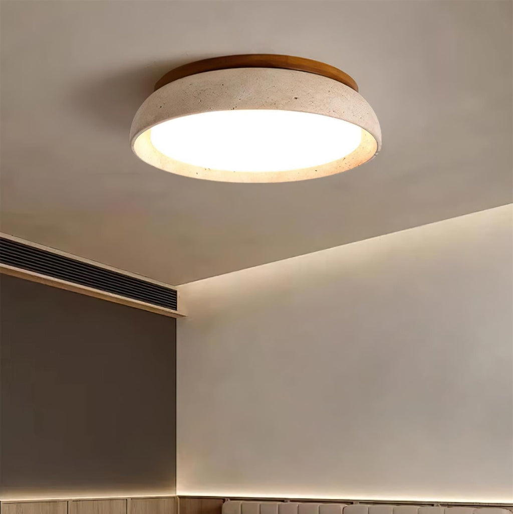 Round flush mount ceiling light with travertine finish and wood-effect trim