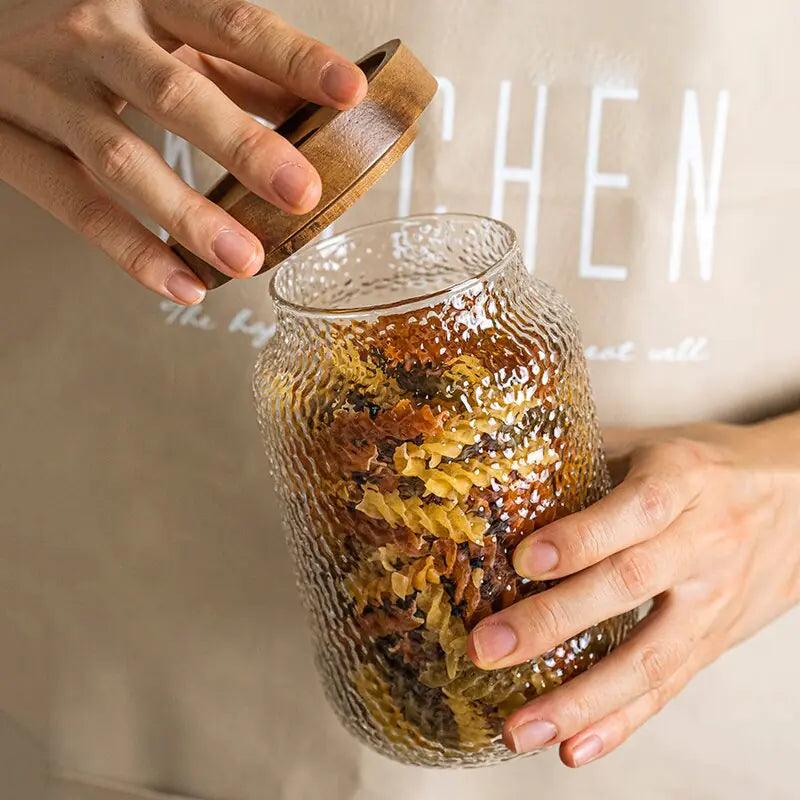 Clear hammered glass storage jar with dark timber lid