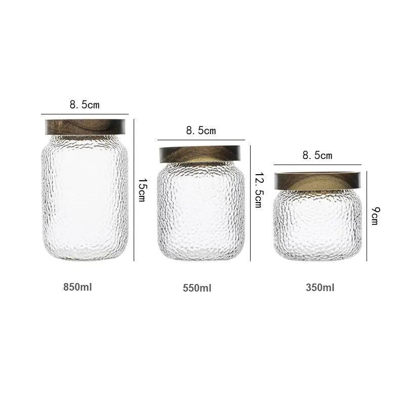 Clear hammered glass storage jar with dark timber lid