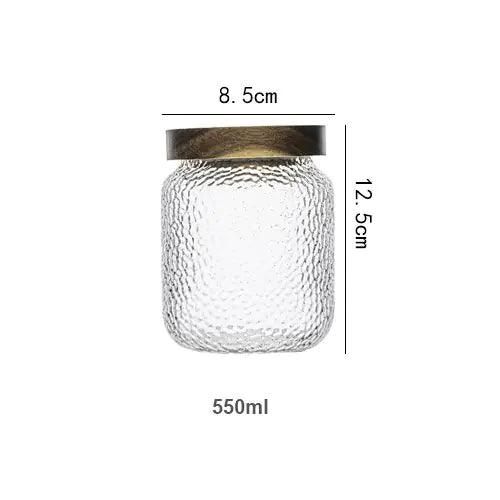 Clear hammered glass storage jar with dark timber lid