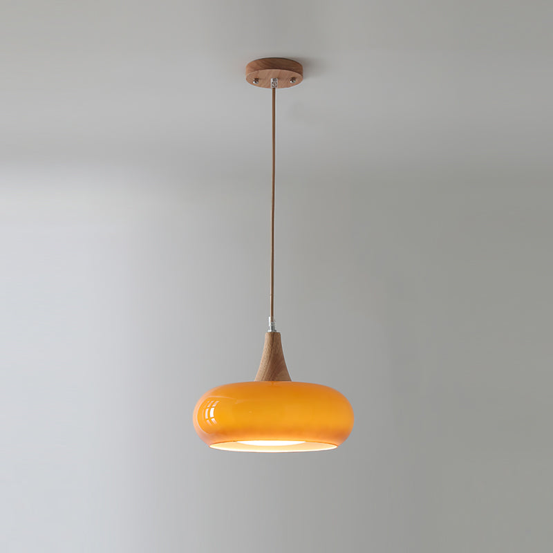 Rounded glass pendant ceiling light with wood-effect details and hanging cable