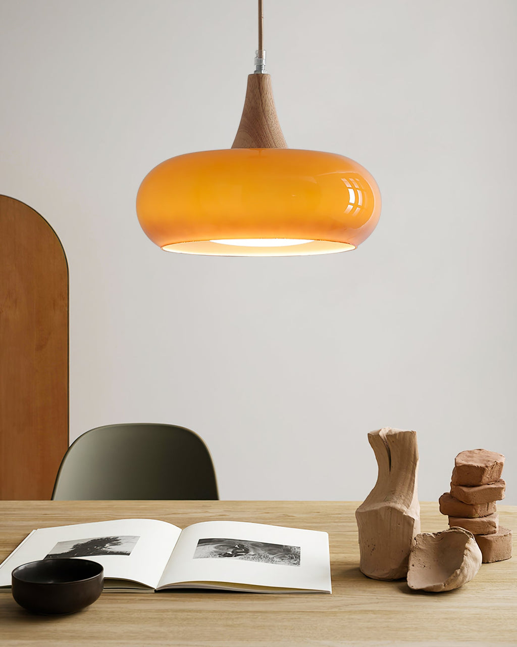 Rounded glass pendant ceiling light with wood-effect details and hanging cable