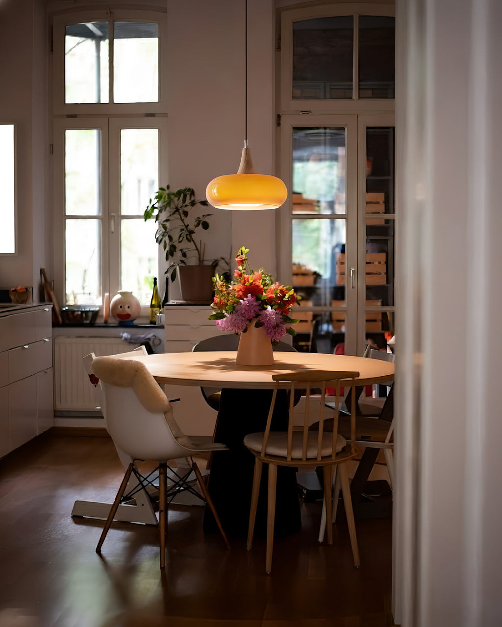 Rounded glass pendant ceiling light with wood-effect details and hanging cable