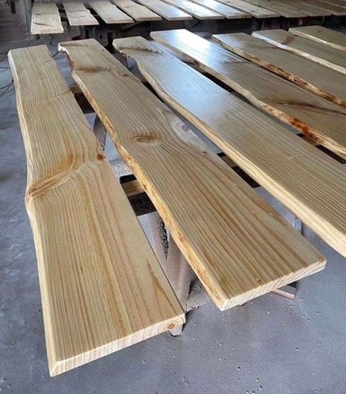 Brown hardwood wall shelf with a naturally shaped live edge