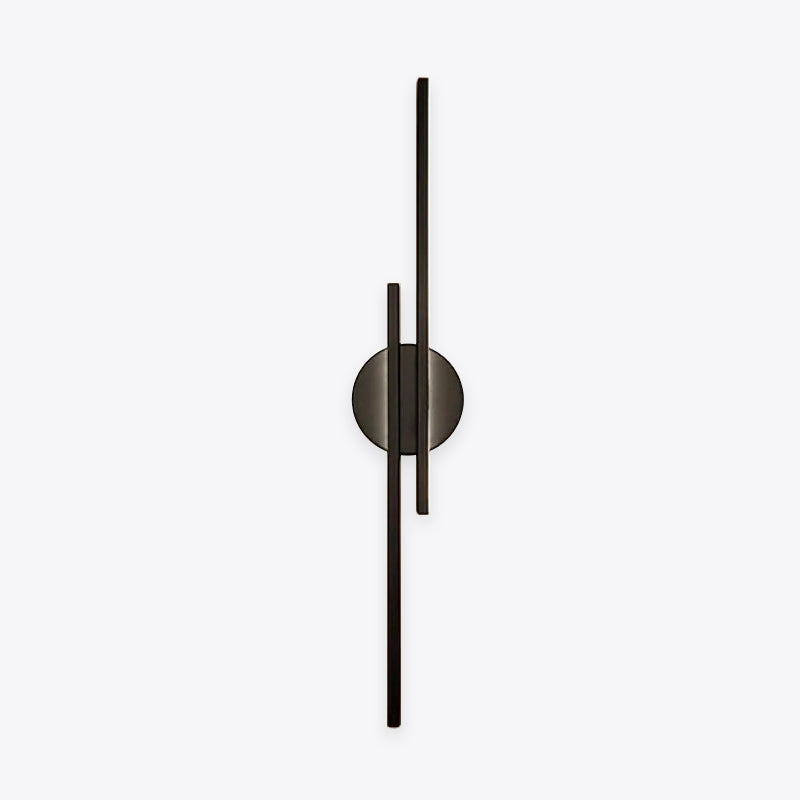 Minimalist metal wall sconce with round backplate and vertical bars