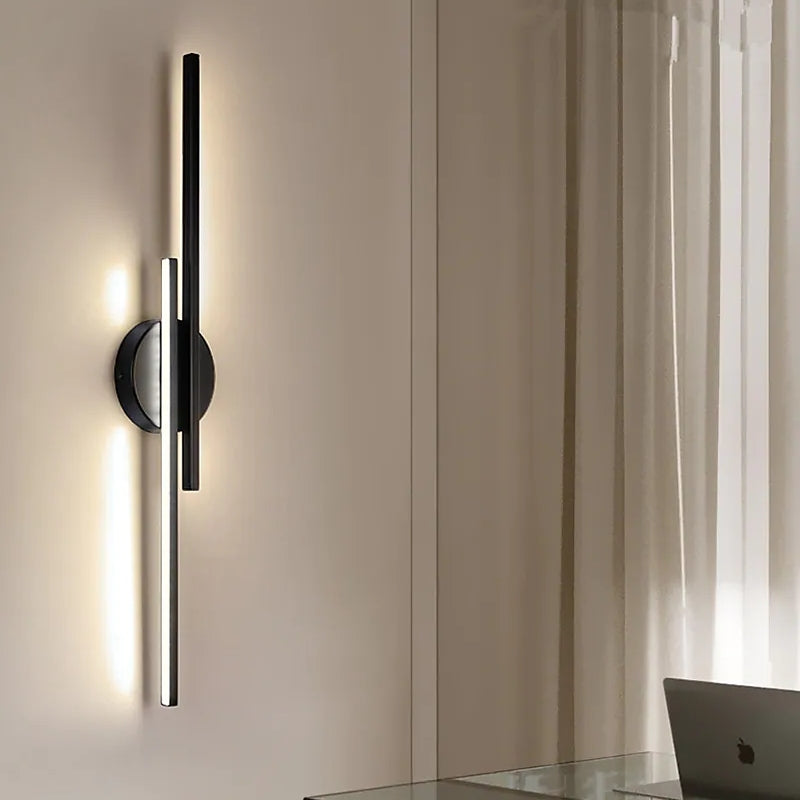 Minimalist metal wall sconce with round backplate and vertical bars