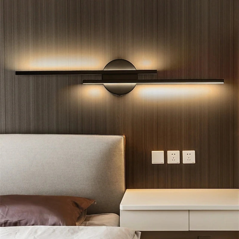 Minimalist metal wall sconce with round backplate and vertical bars