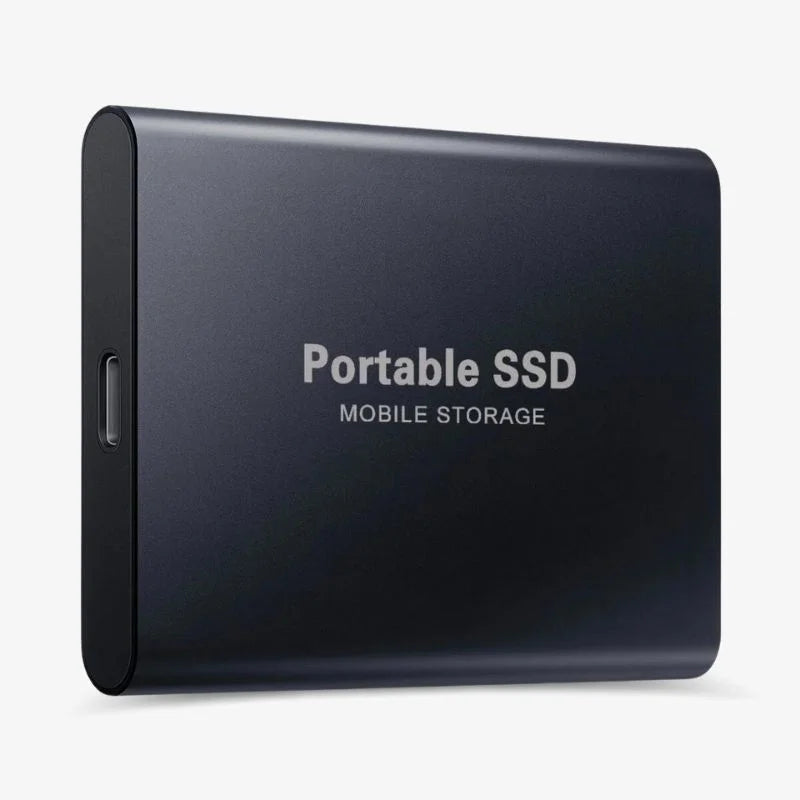 Portable SSD external drive connected to a laptop with USB cable