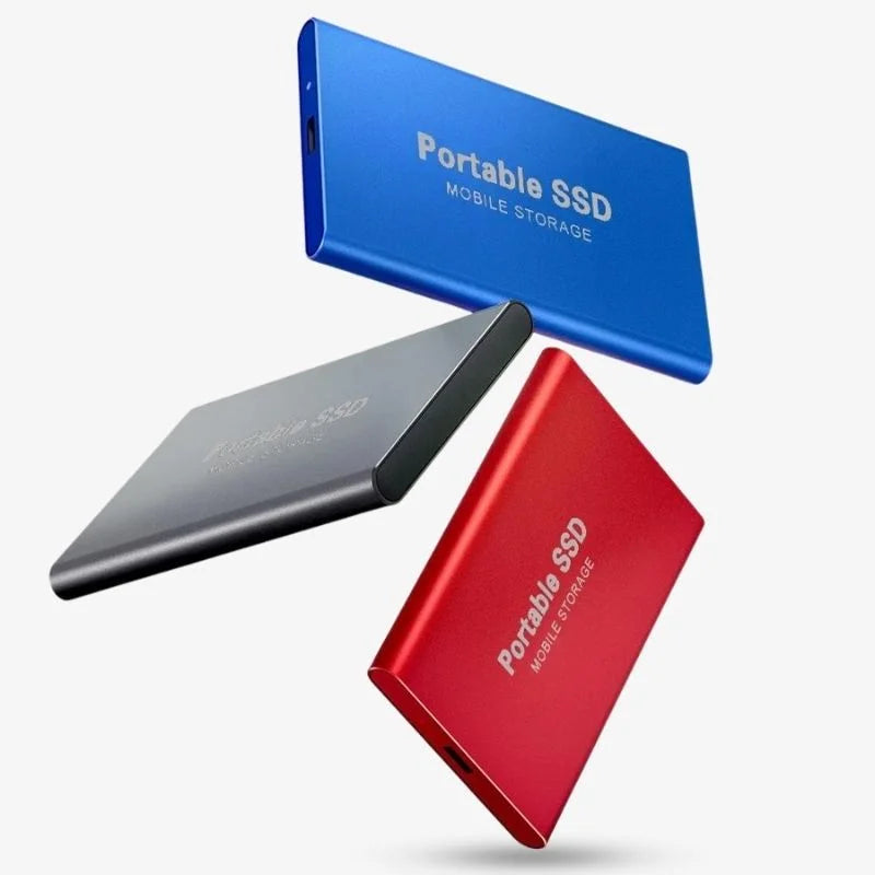 Portable SSD external drive connected to a laptop with USB cable