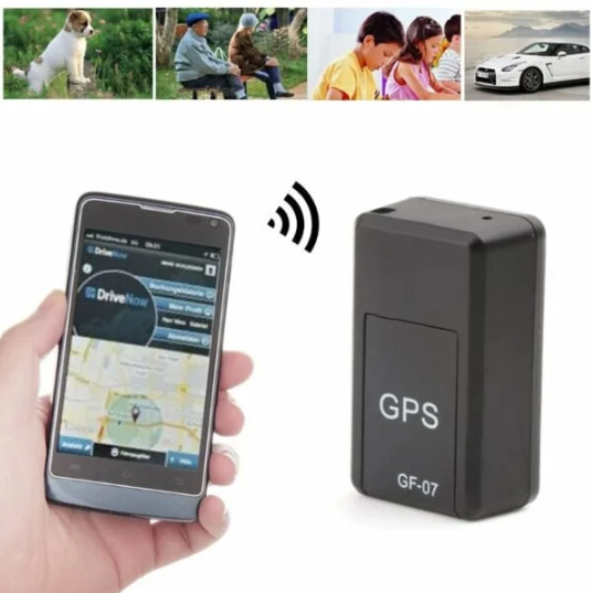 Black GF-07 mini GPS tracker beside a smartphone showing a map