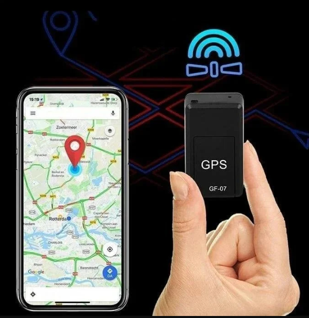 Black GF-07 mini GPS tracker beside a smartphone showing a map