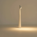 Cordless LED table lamp with a tall tapered body and angled light head
