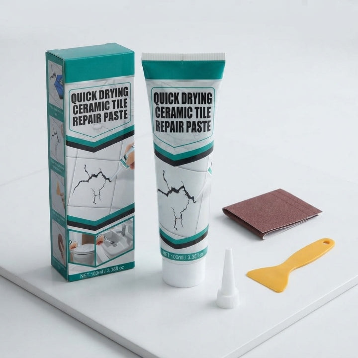 White ceramic tile repair paste tube with nozzle spatula and sandpaper