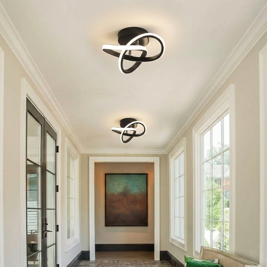 Set of two modern looping LED ceiling lights installed along a hallway