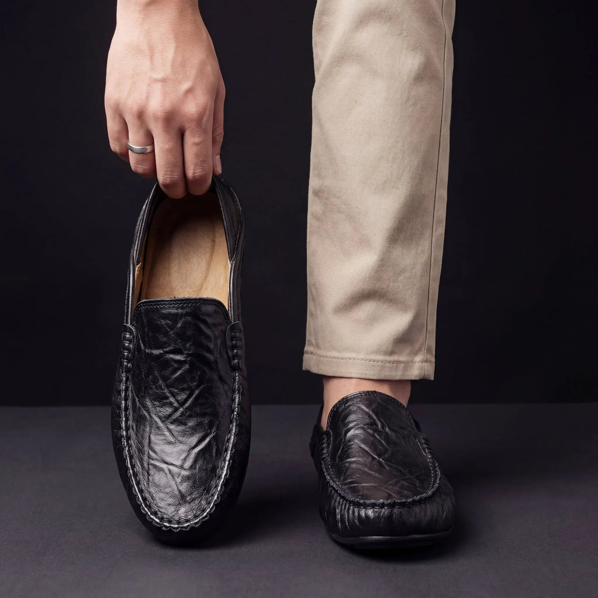 Slip-on moccasin shoes with stitched edging and rounded toes
