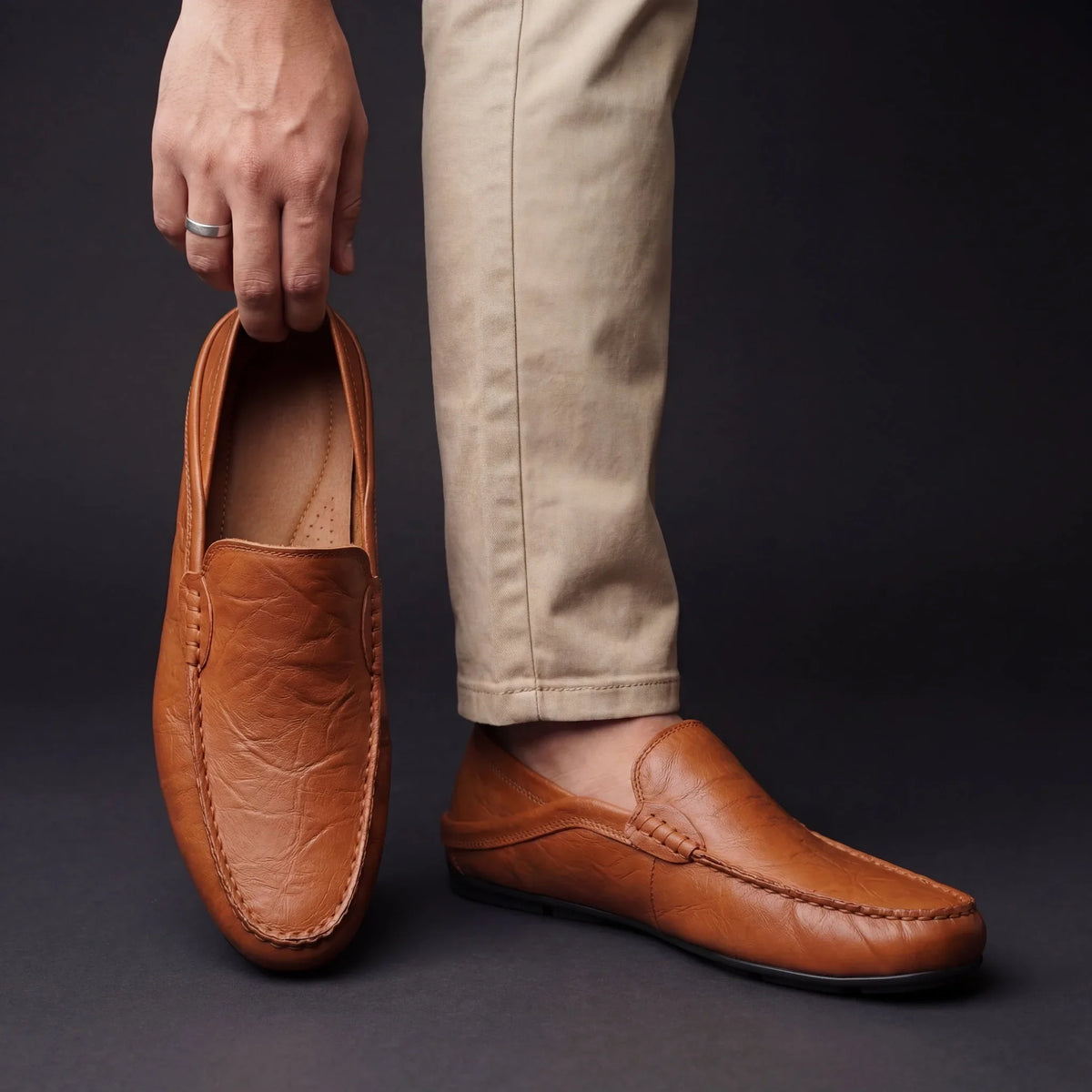 Slip-on moccasin shoes with stitched edging and rounded toes