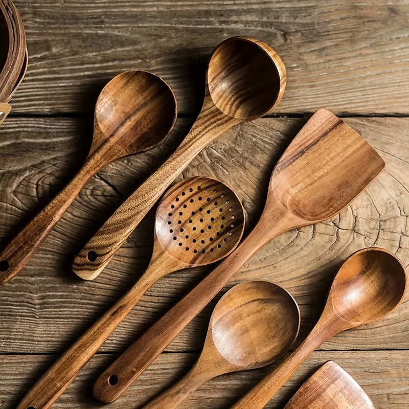 Five-piece brown wooden kitchen utensil set with spoons and spatulas