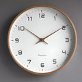 Round analogue wall clock with light dial and wood-effect frame