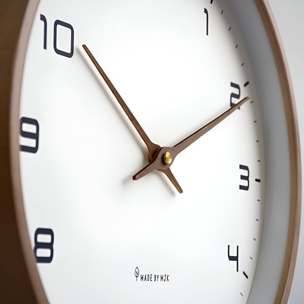 Round analogue wall clock with light dial and wood-effect frame