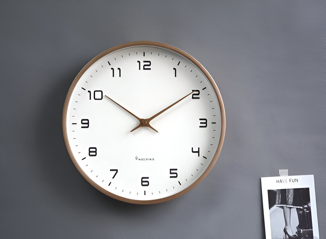 Round analogue wall clock with light dial and wood-effect frame