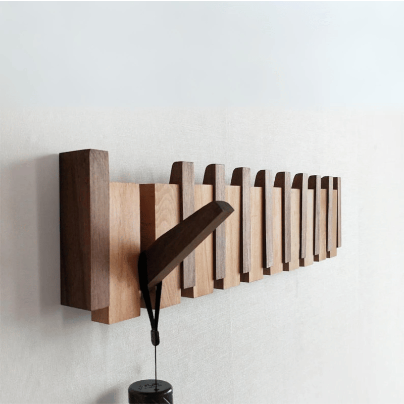 Wall-mounted solid wood coat rack with folding hooks