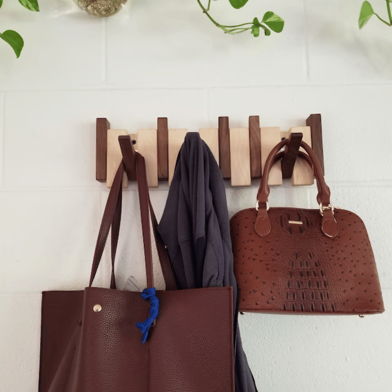 Wall-mounted solid wood coat rack with folding hooks