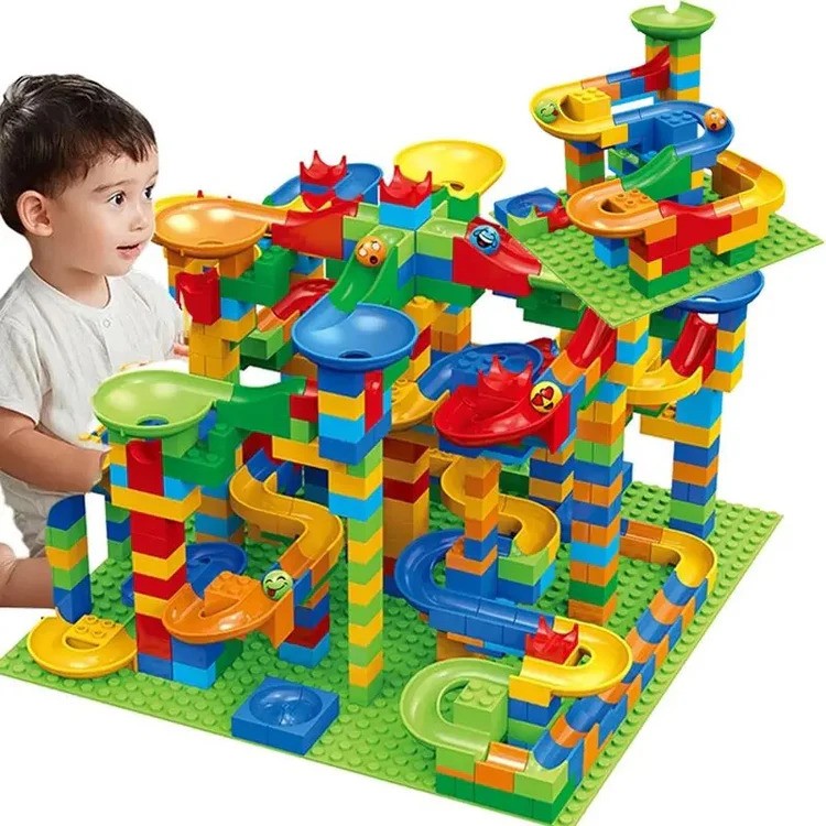 Colourful marble run construction set with interlocking blocks, ramps and tracks