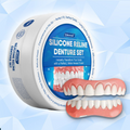 Pink and white silicone reline denture set with upper and lower pieces in a round case