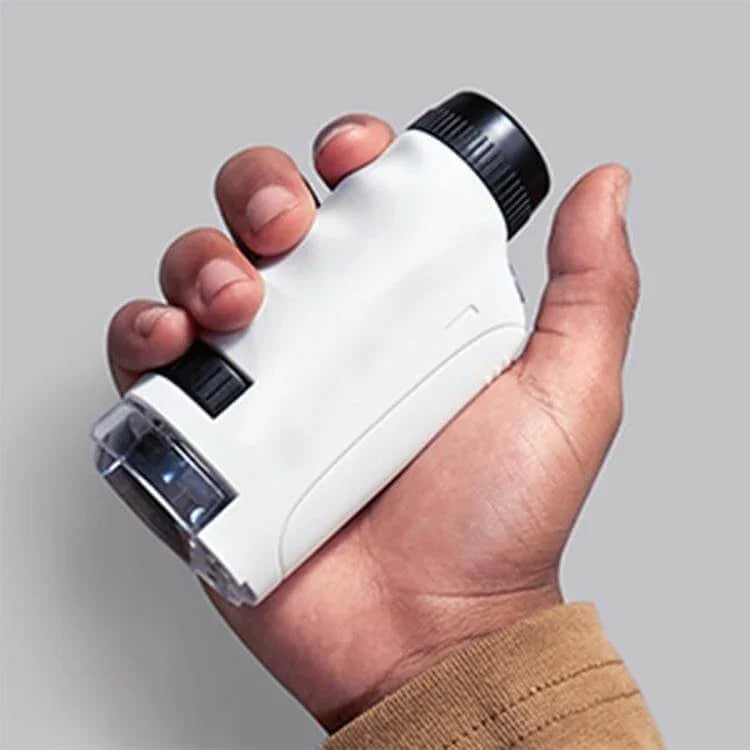White handheld pocket microscope with clear viewing chamber
