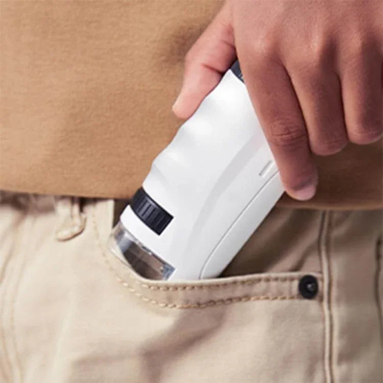 White handheld pocket microscope with clear viewing chamber